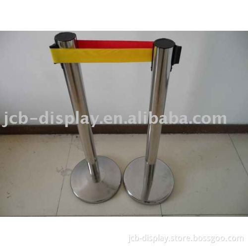 polished stainless steel post with red belt retractable barrier